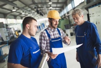 Mechanical and metal industry engineers working in factory