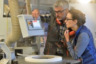 Woman in professional training, wood industrial site