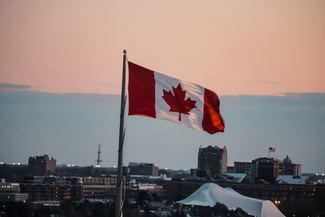 Flag in the window over a city