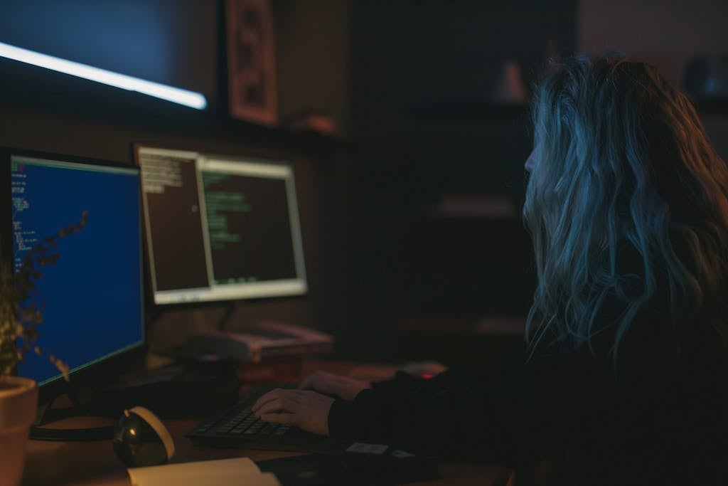 A Woman Typing on Keyboard